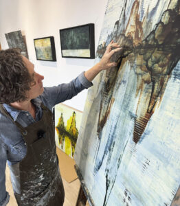 Perri Lynch Howard painting in her studio