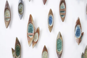 Ceramic canoes holding blue crystals