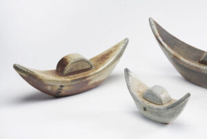 Ceramic funerary canoe urns