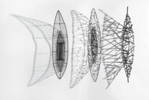 A trio of wired canoes